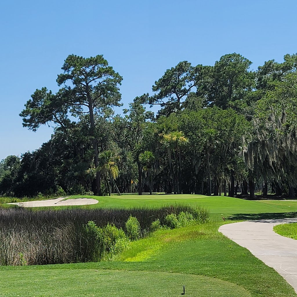 Panoramic view of a lush green golf course at Moss Creek Golf Club. Smooth