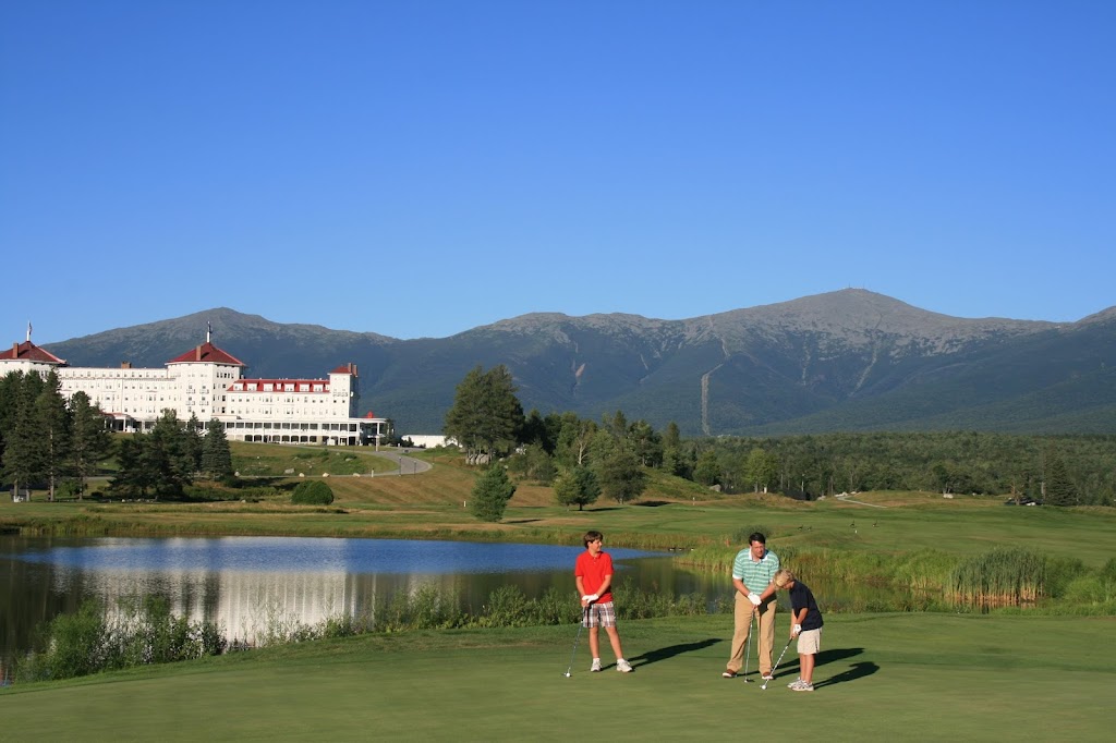 Panoramic view of a lush green golf course at Mount Washington Resort Golf Club. Smooth