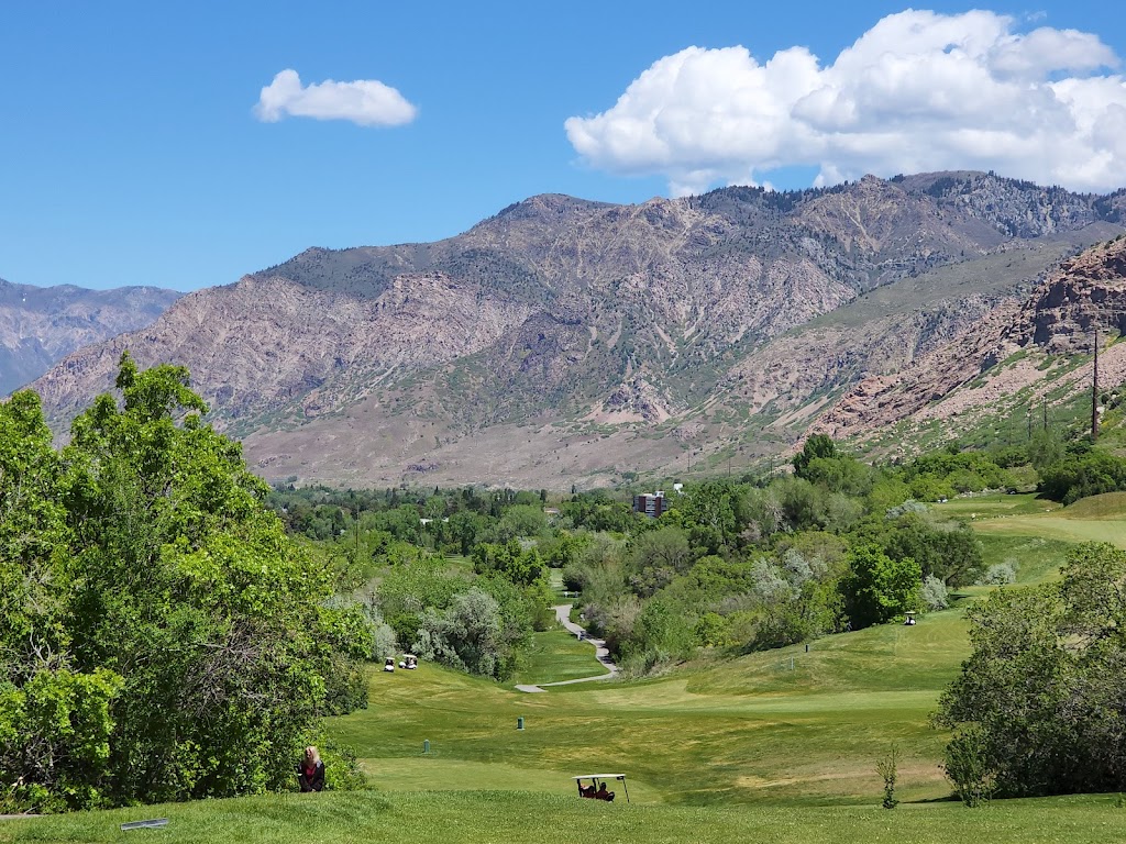 Panoramic view of a lush green golf course at Mt. Ogden Golf Course. Smooth