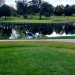 Panoramic view of a lush green golf course at Muscatine Municipal Golf Course. Smooth