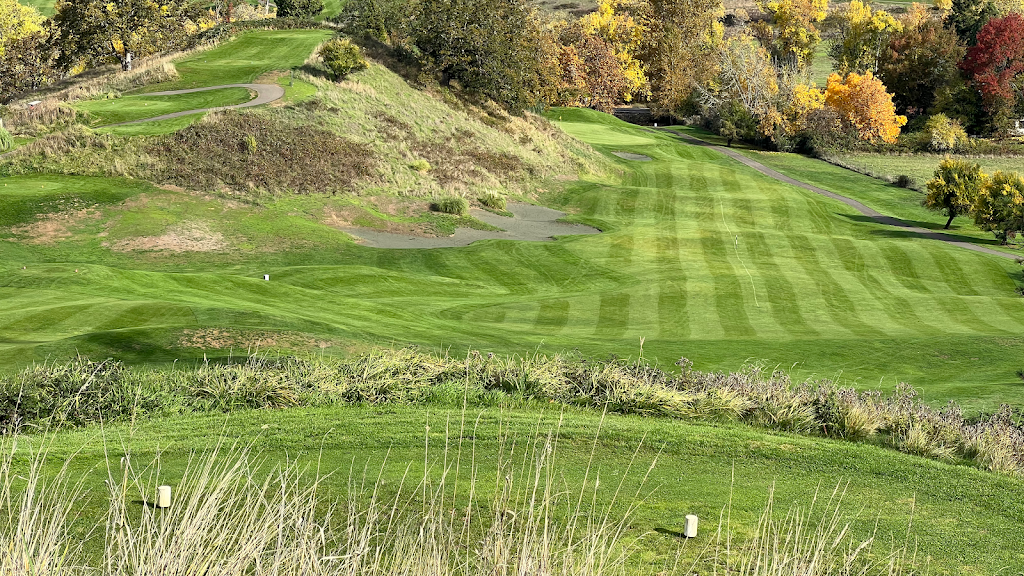 Panoramic view of a lush green golf course at Myrtle Creek Golf Club. Smooth