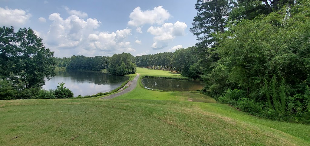 Panoramic view of a lush green golf course at Mystery Valley Golf Course. Smooth