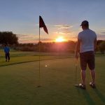 green grass with the flag in the hole.