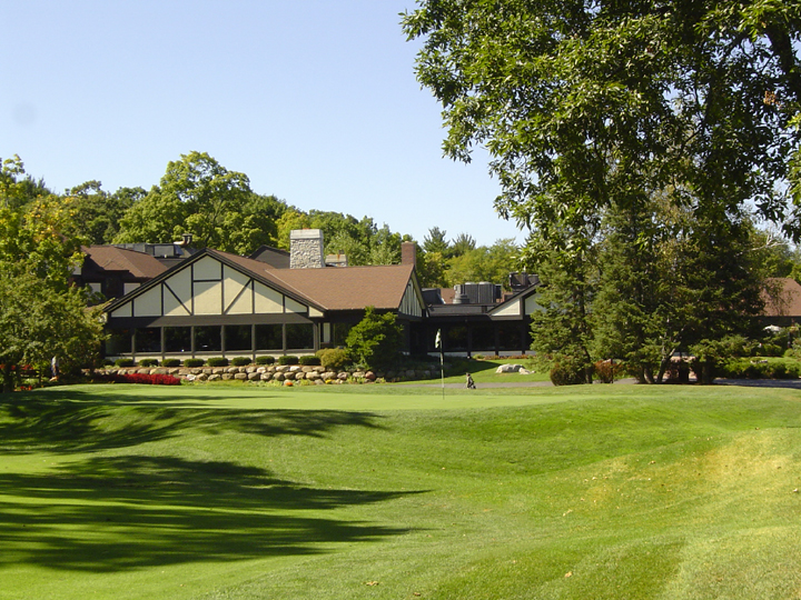 Panoramic view of a lush green golf course at Nakoma Golf Club. Smooth