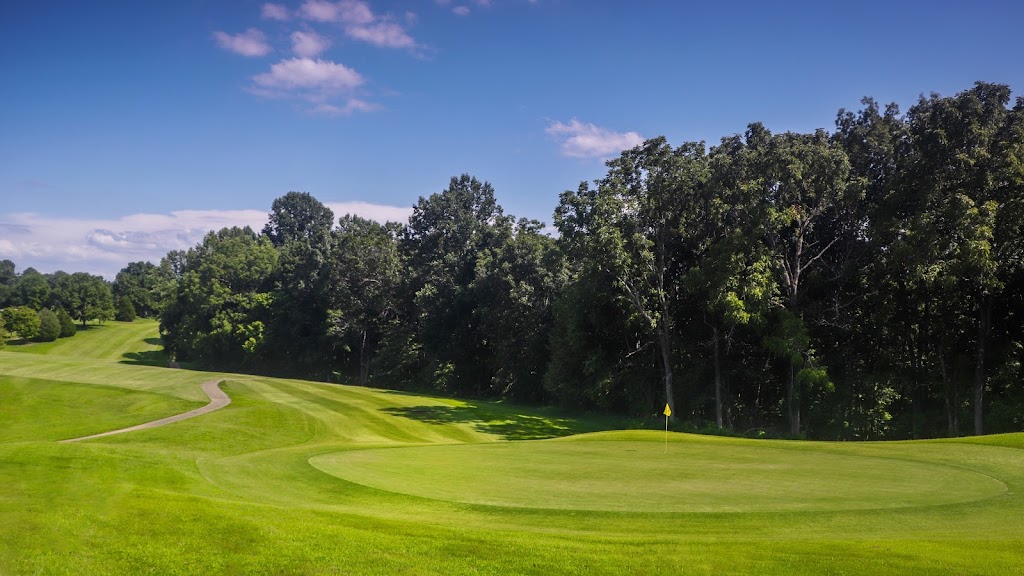 Panoramic view of a lush green golf course at Nashville National Golf Links. Smooth