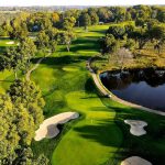 Panoramic view of a lush green golf course at National Golf Club-Kansas City. Smooth