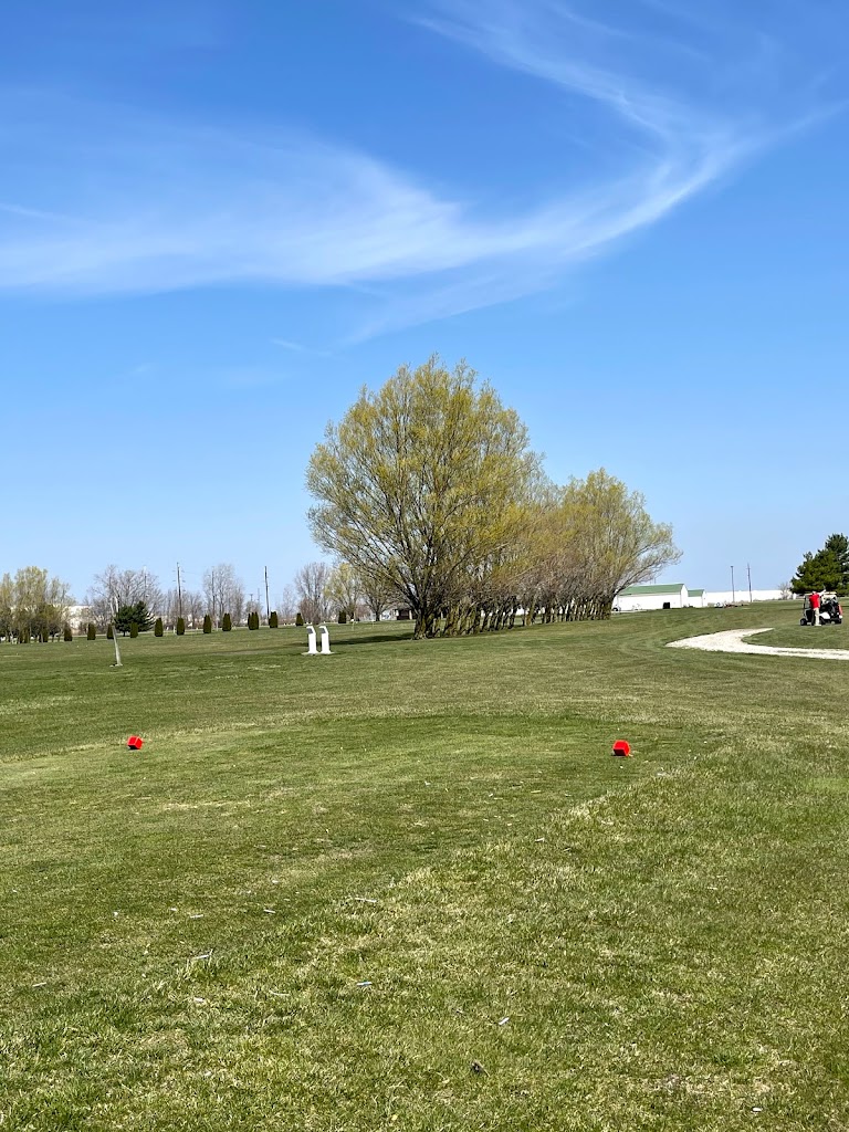 Panoramic view of a lush green golf course at National Road Golf Course. Smooth