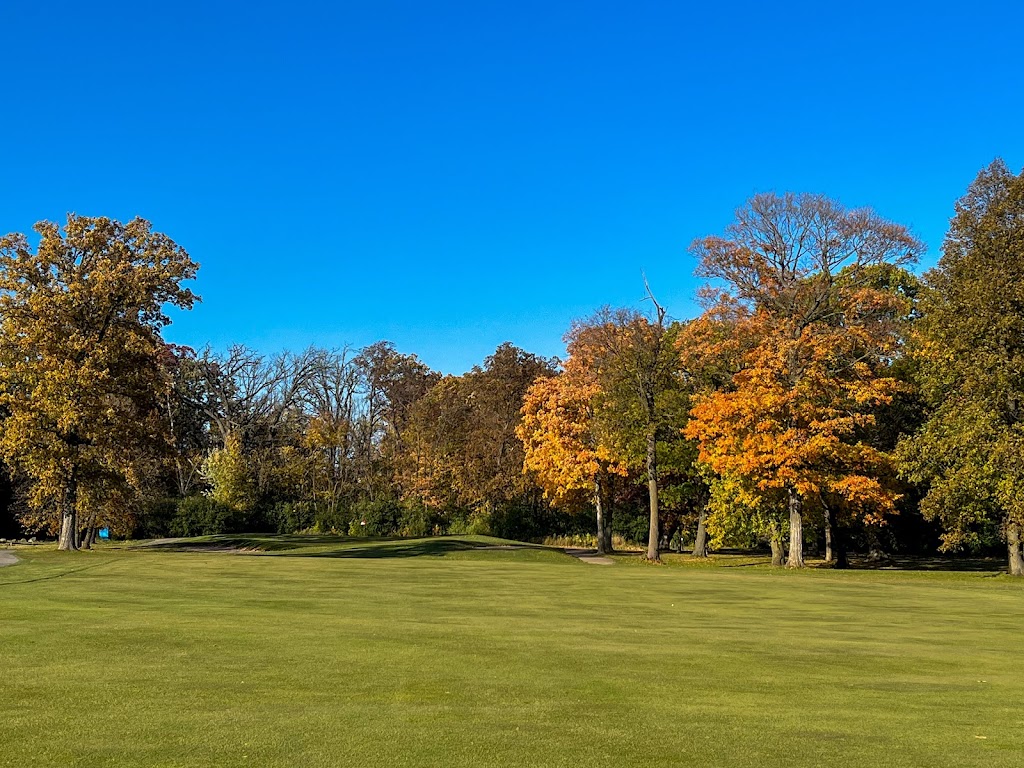 Panoramic view of a lush green golf course at New Berlin Hills Golf Course. Smooth