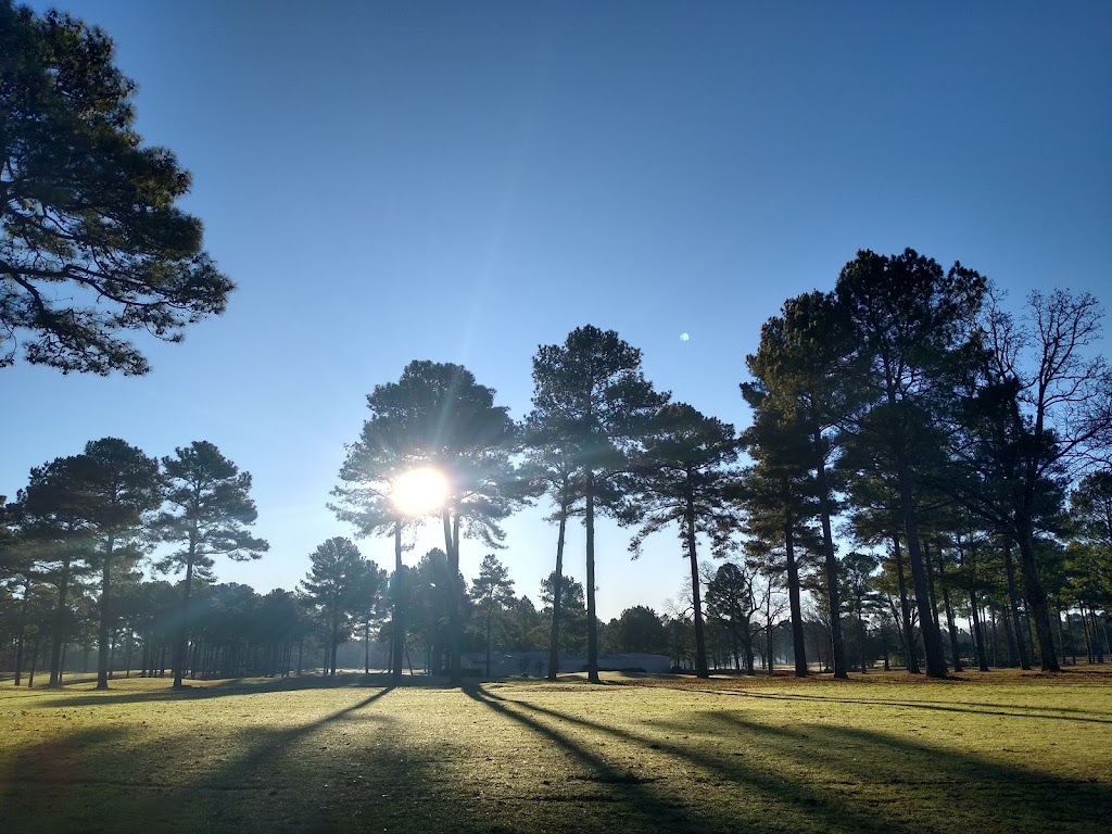 Panoramic view of a lush green golf course at New Haven Golf Club. Smooth