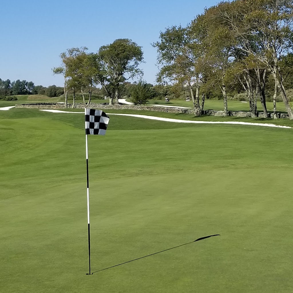 Panoramic view of a lush green golf course at Newport National Golf Club. Smooth