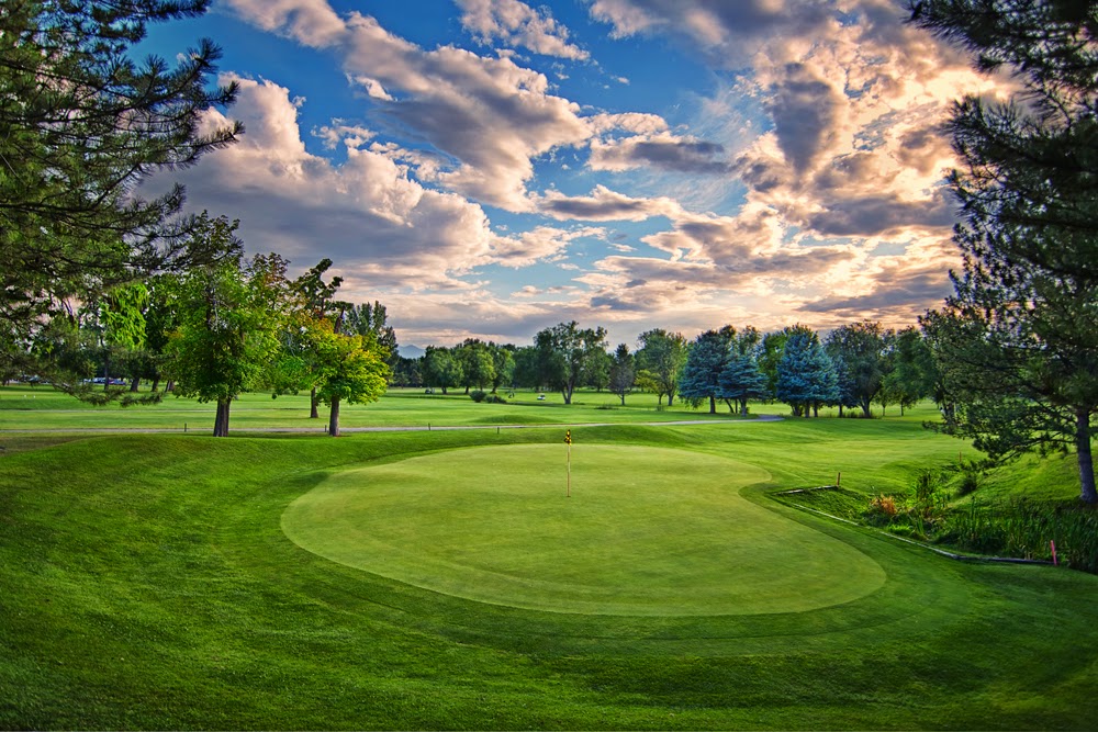 Panoramic view of a lush green golf course at Nibley Park Golf Course. Smooth