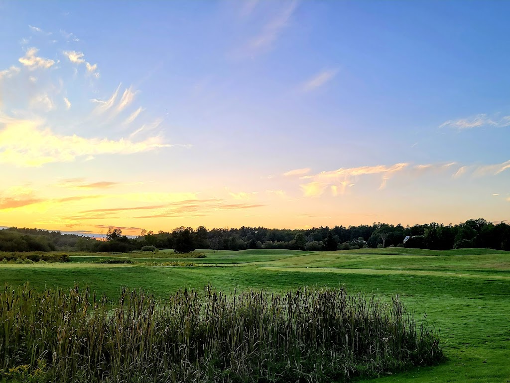 Panoramic view of a lush green golf course at Nonesuch River Golf Club. Smooth