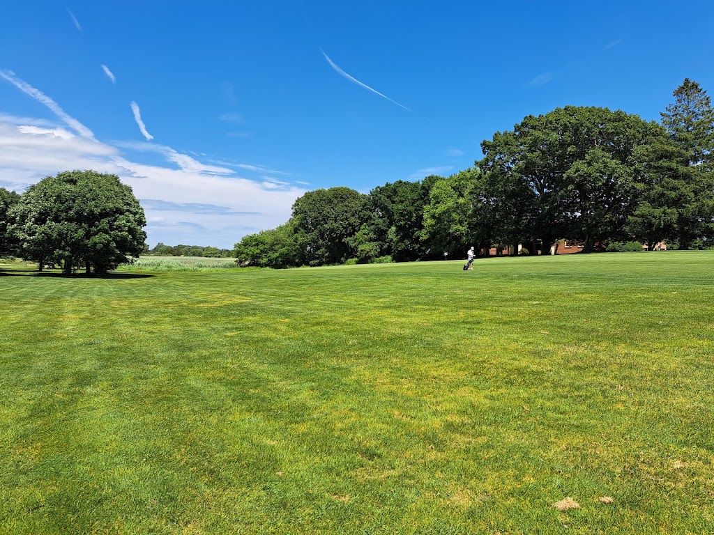 Panoramic view of a lush green golf course at North Kingstown Golf Course. Smooth