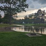 green grass with the flag in the hole.