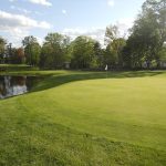 Panoramic view of a lush green golf course at Northfield Golf Club. Smooth