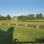 Panoramic view of a lush green golf course at Northville Hills Golf Club. Smooth