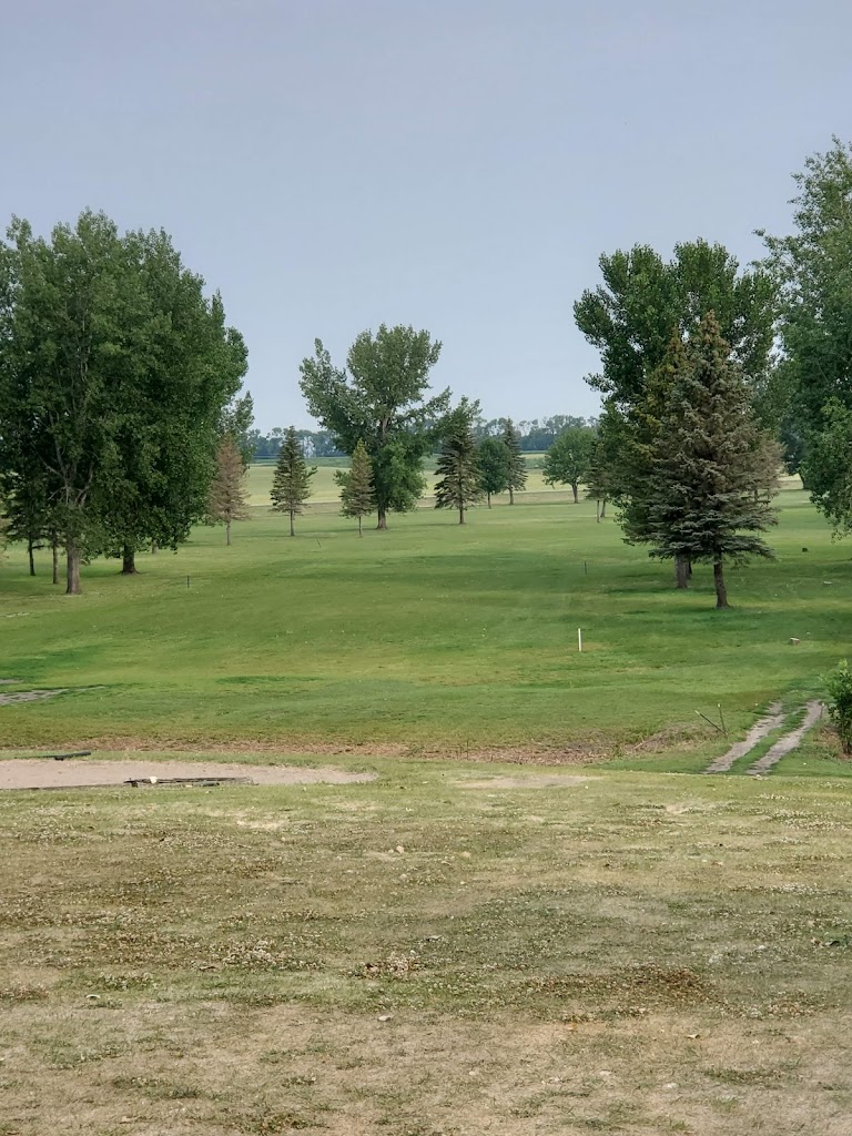 Panoramic view of a lush green golf course at Northwood Golf Course. Smooth