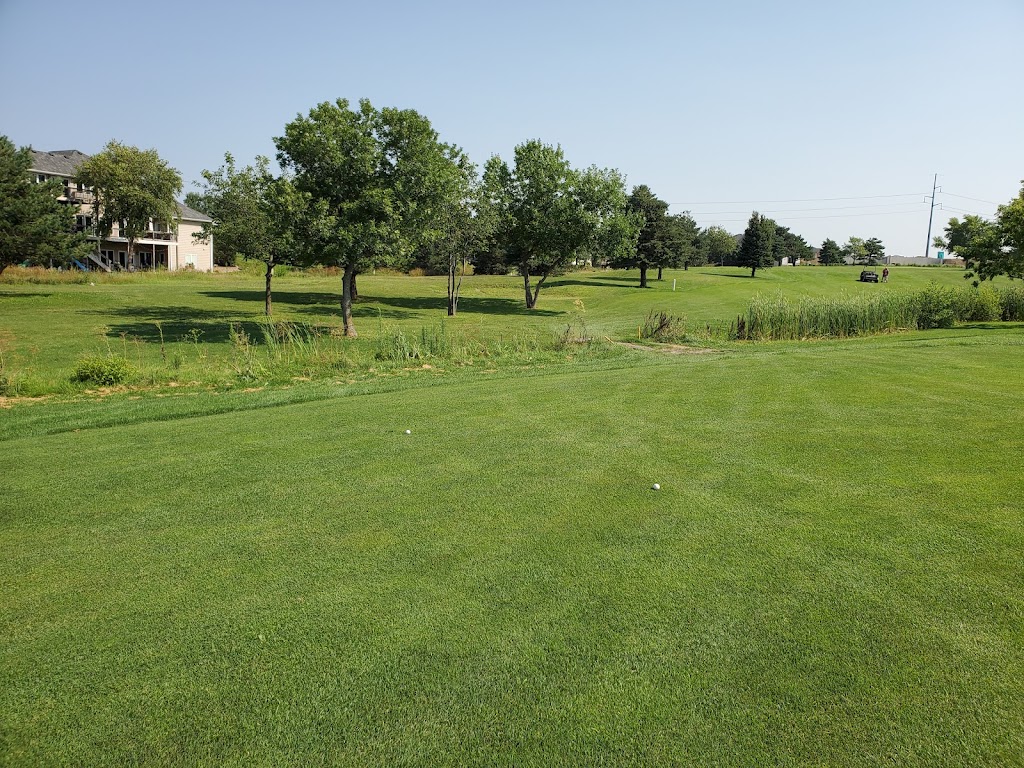 Panoramic view of a lush green golf course at NuMark Golf Course. Smooth