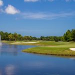 Panoramic view of a lush green golf course at ONE Club Golf Course Gulf Shores. Smooth