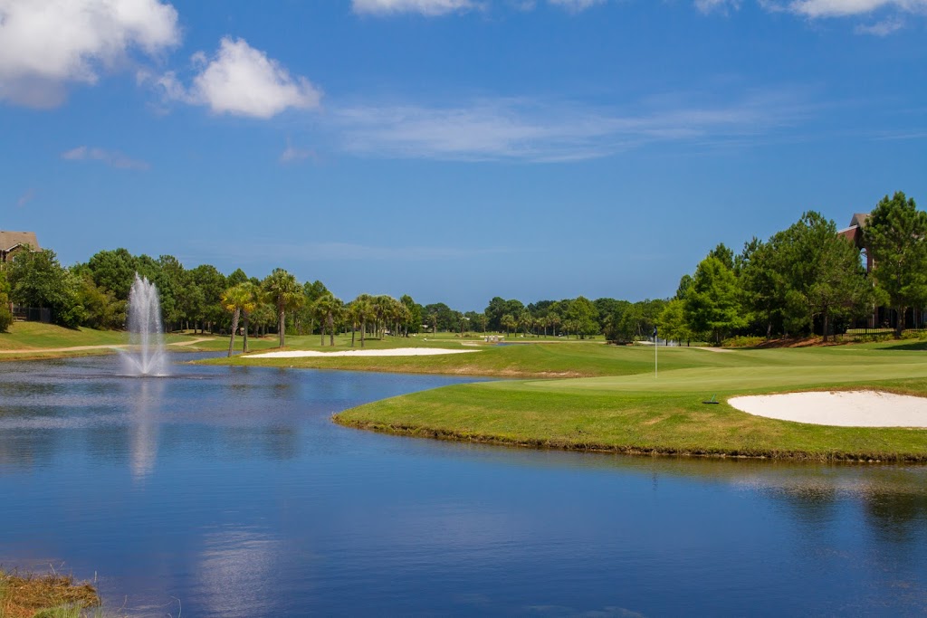 Panoramic view of a lush green golf course at ONE Club Golf Course Gulf Shores. Smooth