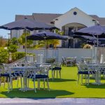 Panoramic view of a lush green golf course at ONE Club Gulf Shores. Smooth