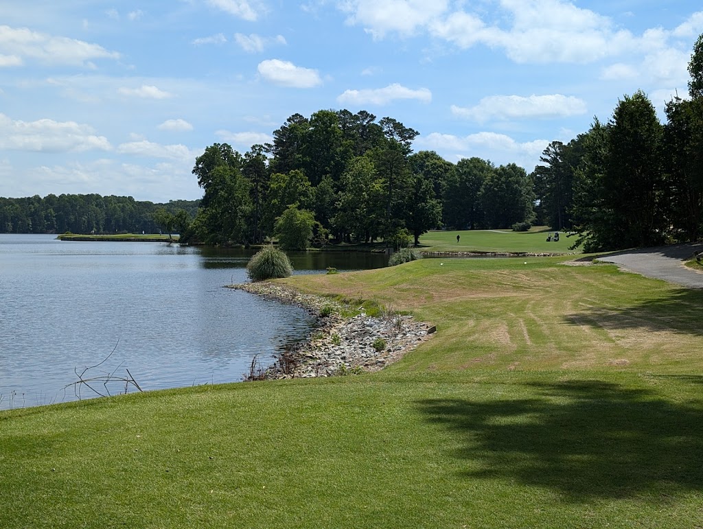 Panoramic view of a lush green golf course at Oak Hollow Golf Course. Smooth