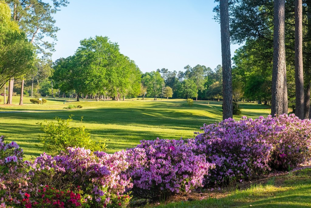 Panoramic view of a lush green golf course at Oak Knoll Country Club. Smooth