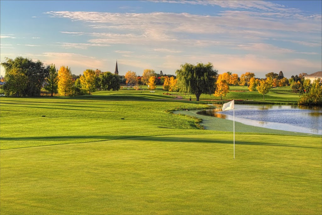 Panoramic view of a lush green golf course at Oak Marsh Golf Course and Event Center. Smooth