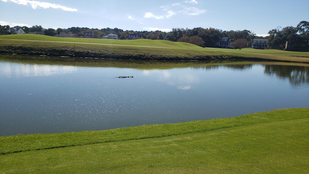 Panoramic view of a lush green golf course at Oak Point Golf Course. Smooth