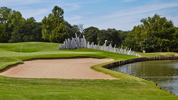 Panoramic view of a lush green golf course at Oak Tree Country Club. Smooth