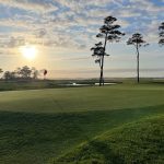 Panoramic view of a lush green golf course at Ocean City Golf Club. Smooth