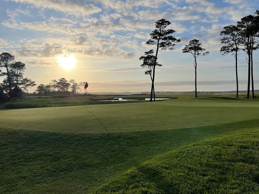 Panoramic view of a lush green golf course at Ocean City Golf Club. Smooth