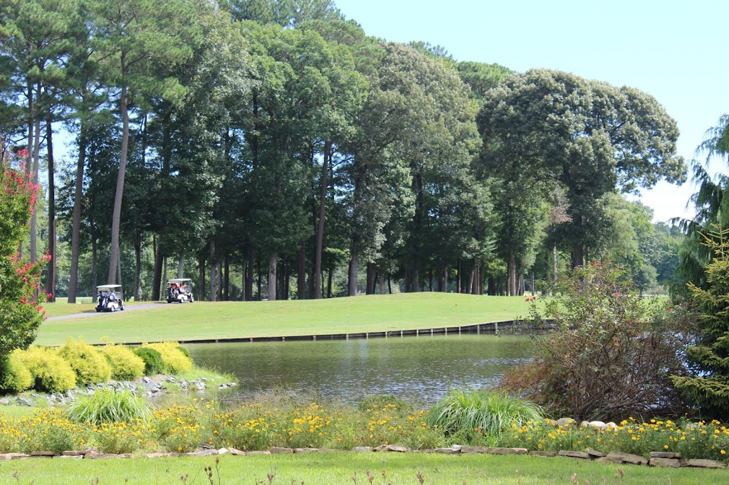 Panoramic view of a lush green golf course at Ocean Pines Golf Club. Smooth