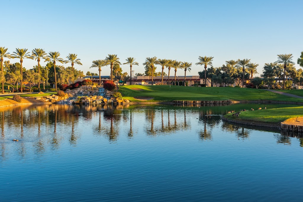 Panoramic view of a lush green golf course at Ocotillo Golf Club. Smooth