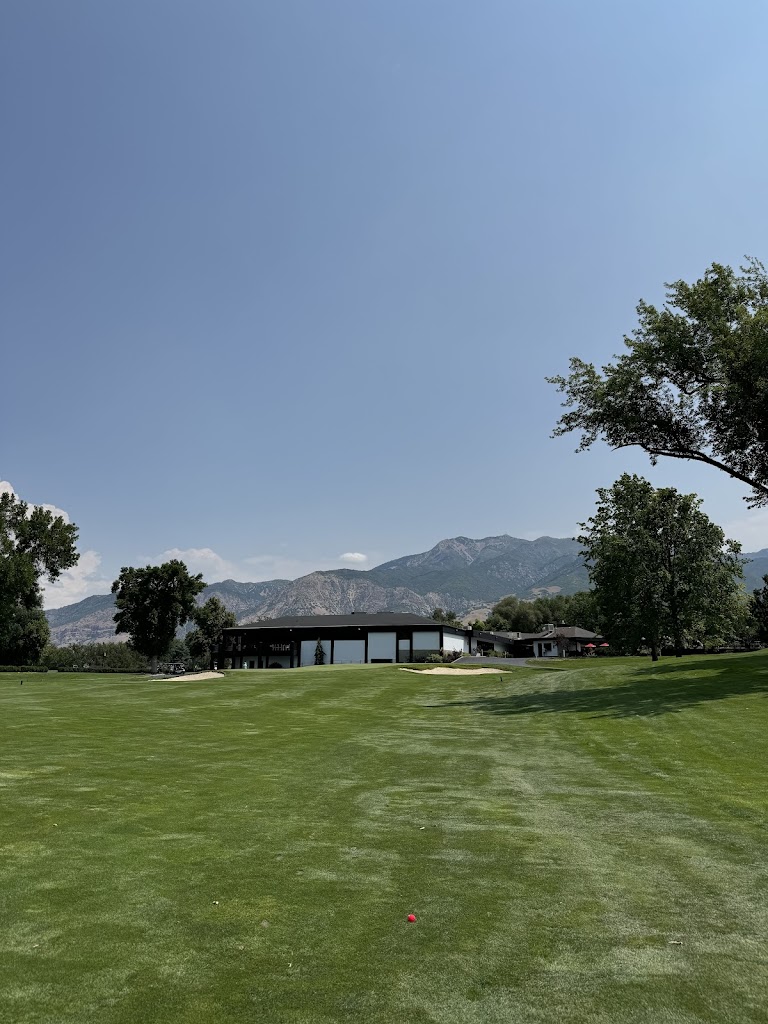 Panoramic view of a lush green golf course at Ogden Golf & Country Club. Smooth