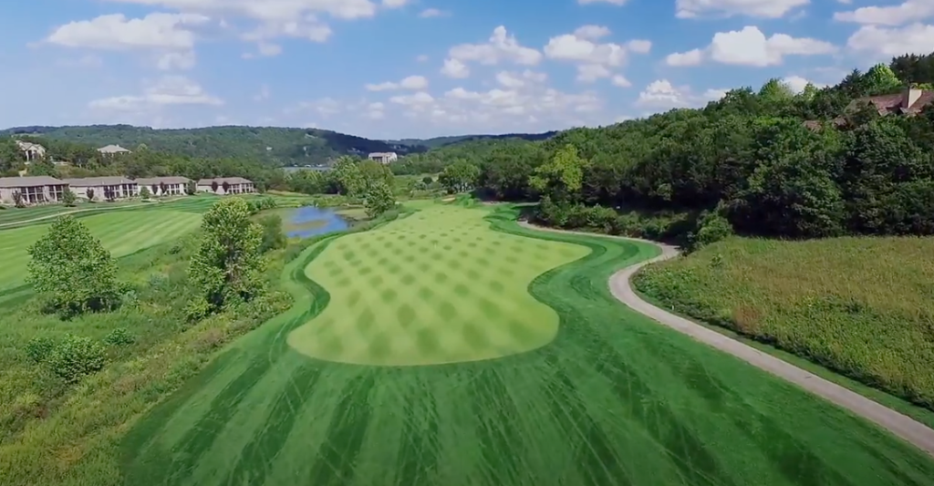 Panoramic view of a lush green golf course at Old Kinderhook Golf Course. Smooth