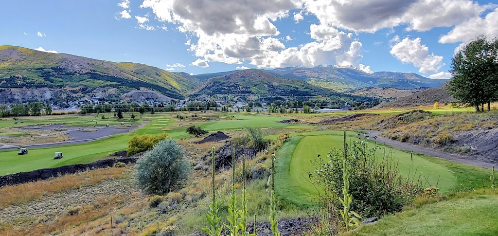 Panoramic view of a lush green golf course at Old Works Golf Course. Smooth