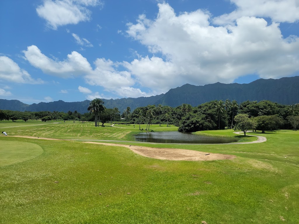 Panoramic view of a lush green golf course at Olomana Golf Links. Smooth