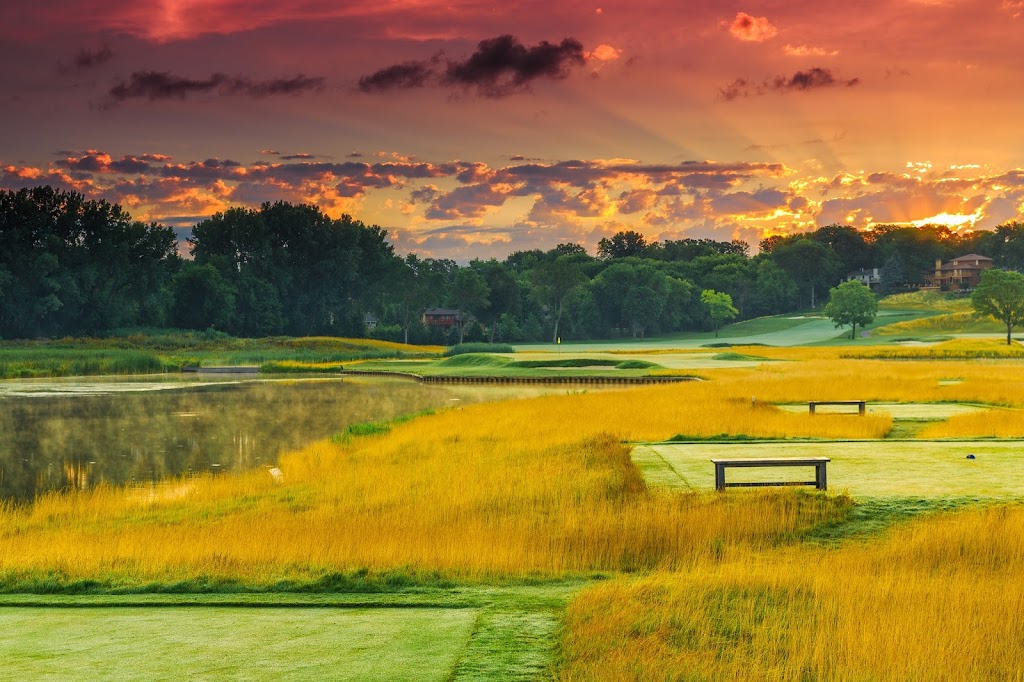 Panoramic view of a lush green golf course at Olympic Hills Golf Club. Smooth