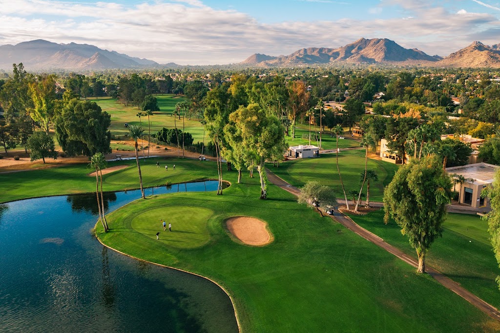 Panoramic view of a lush green golf course at Orange Tree Golf Resort