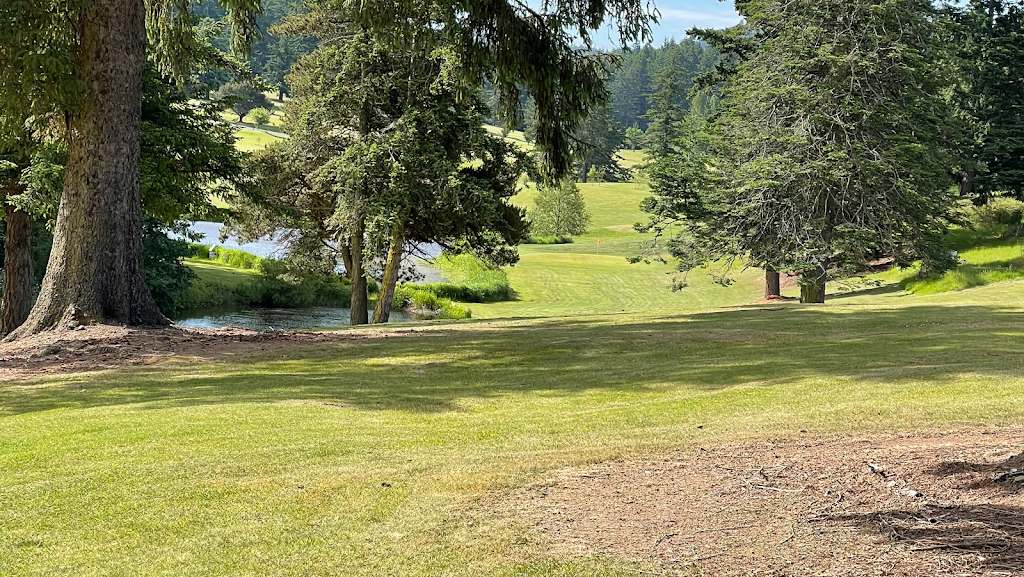 Panoramic view of a lush green golf course at Orcas Island Golf Course. Smooth