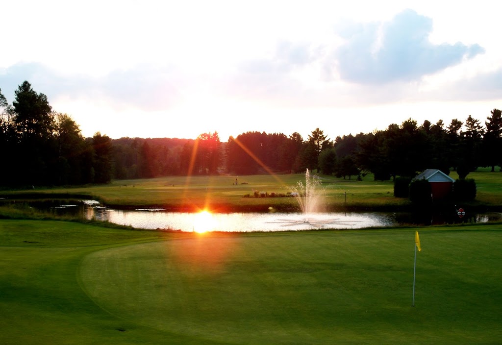 Panoramic view of a lush green golf course at Orleans Country Club. Smooth