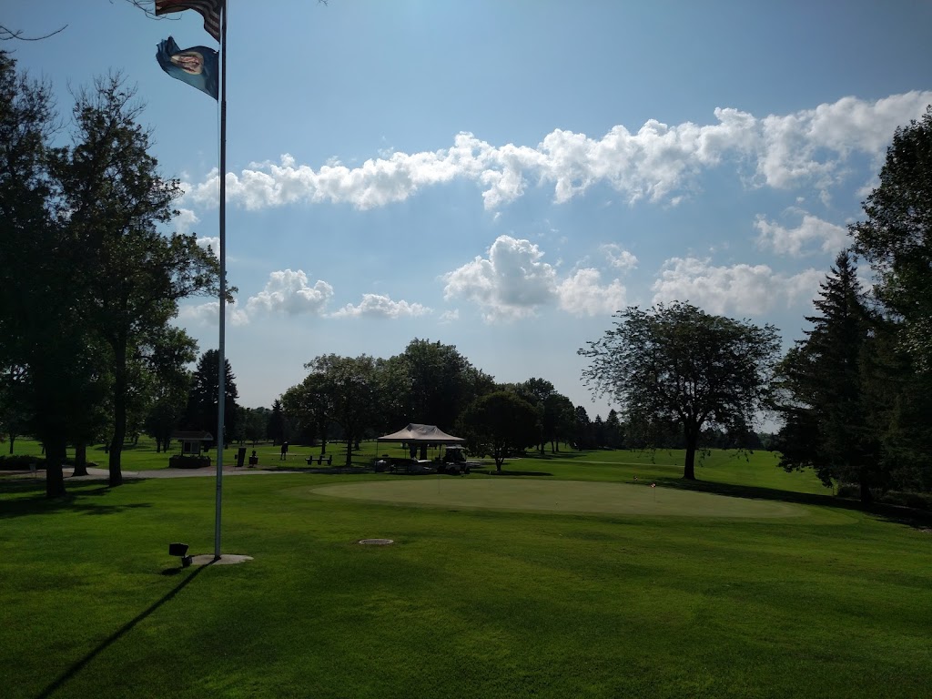 Panoramic view of a lush green golf course at Ortonville Municipal Golf Course. Smooth