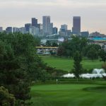 Panoramic view of a lush green golf course at Overland Golf Course. Smooth