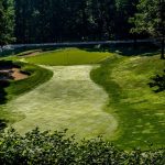 Panoramic view of a lush green golf course at Overlook Golf Club. Smooth