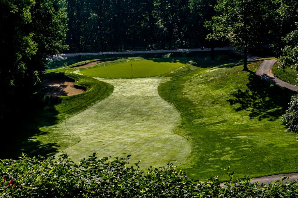 Panoramic view of a lush green golf course at Overlook Golf Club. Smooth