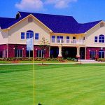 Panoramic view of a lush green golf course at Owasso Golf & Athletic Club. Smooth