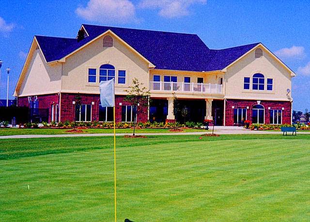 Panoramic view of a lush green golf course at Owasso Golf & Athletic Club. Smooth