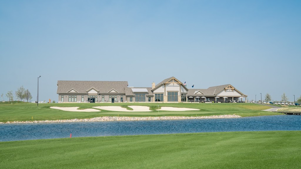 Panoramic view of a lush green golf course at Oxbow Country Club. Smooth