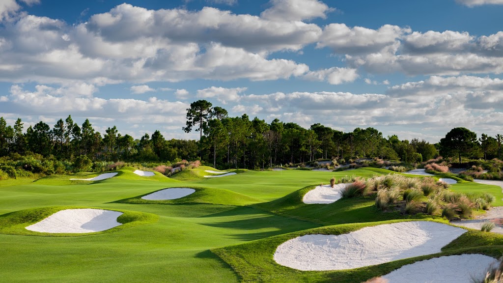 Panoramic view of a lush green golf course at PGA Golf Club at PGA Village. Smooth